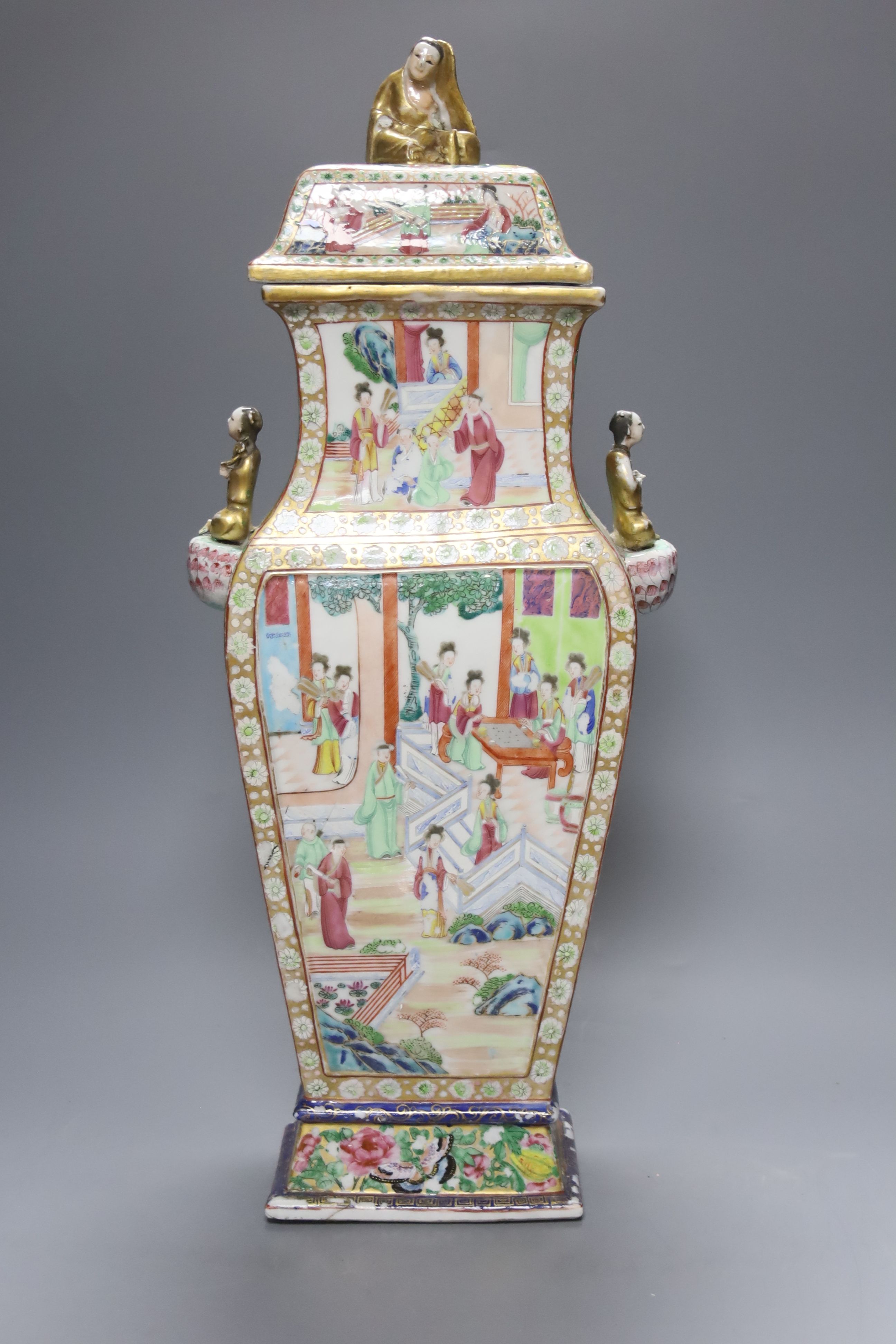 A large Chinese famille rose Canton decorated vase and cover, Daoguang period, height 53cm (a.f)